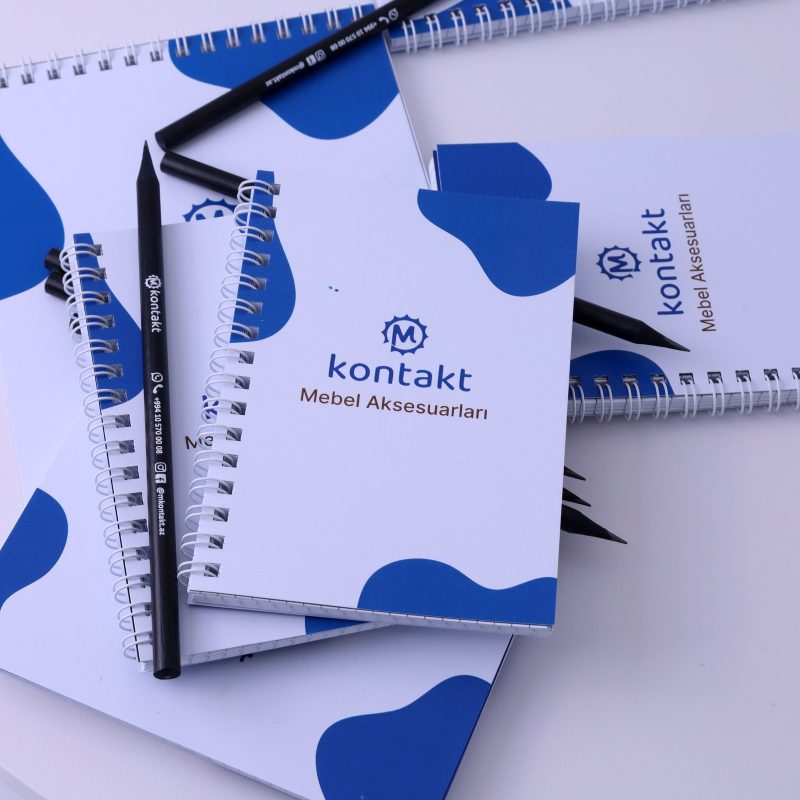 Kontakt Mebel Aksesuarları — wire-bound notebook and printed pencil